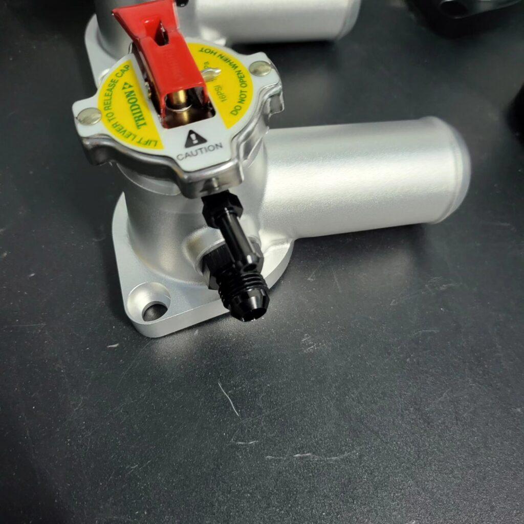 Barra and sohc billet thermostat housing with cap